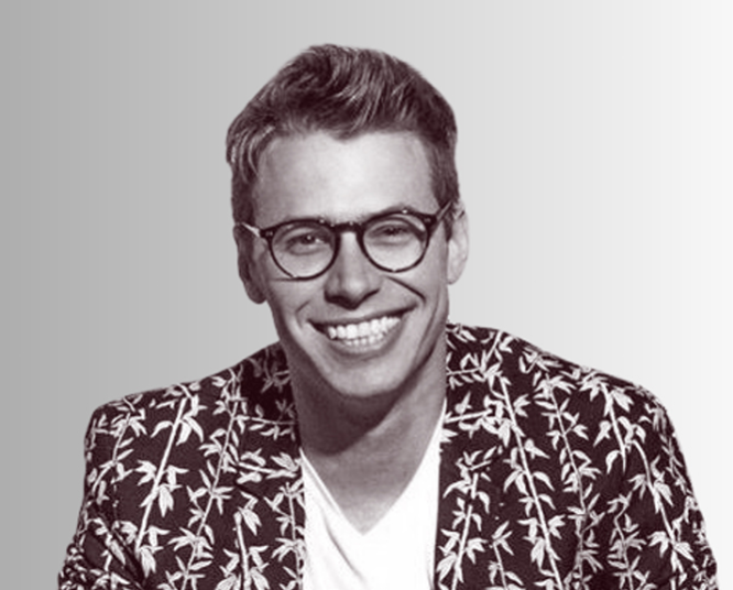 A man with glasses and a jacket on.